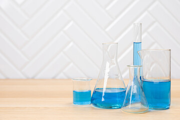 Laboratory glassware with test tubes. flasks, dropper, petri dishes, measuring cups and cylinders for scientific laboratories, laboratory equipment and analysis