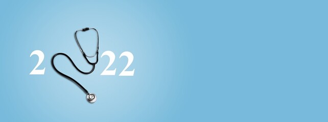 2022 number with stethoscope. Happy New Year for heart health and medical concept,