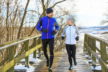 Couple Running on stairs in Snowy Park in winter season