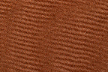 Brown denim fabric. Texture background. Close up.