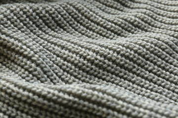 Fototapeta na wymiar Beautiful grey knitted fabric as background, closeup