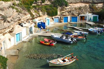 Fototapeta na wymiar Beautiful fishermen seaside village of Mandrakia with colourful boat houses called 