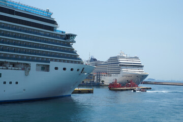 Colossal cruise ship liner anchored in port of Piraeus ready to depart for Aegean destination islands, Attica, Greece                                