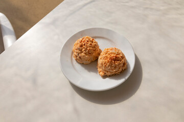 Octopus salad, in the form of a ball served on a plate. Spanish cuisine concept.