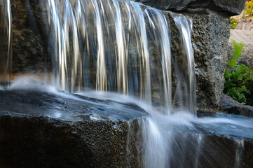 Long exposure artificial waterfall in leisure park