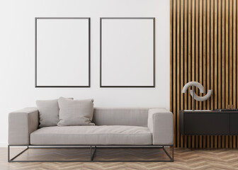 Two empty vertical picture frames on white wall in modern living room. Mock up interior in contemporary style. Free space for picture, poster. Sofa, console, sculpture, parquet floor. 3D rendering.