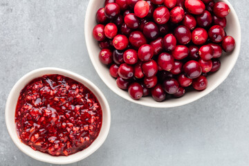 Red berries on a dark background. cranberries in a bowl.