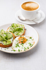 Keto Toasts with ricotta, egg, cucumber and black sesame.