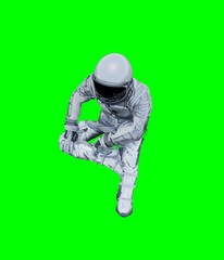 Astronaut isolated on green background perfect for photo compositing