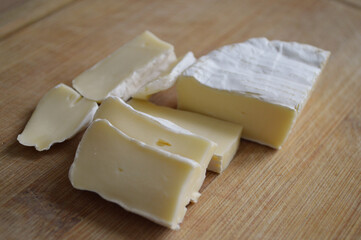 Close-up of sliced camembert cheese on cutting board