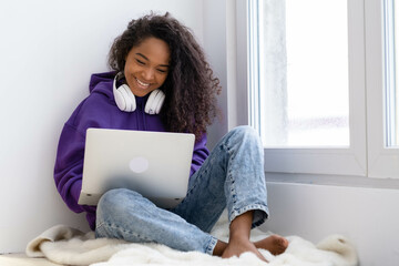 Happy attractive african american girl working office work remotely from home Black woman using laptop computer Distance learning online education and work 