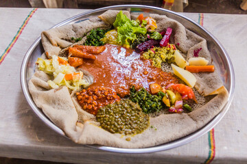 Typical meal in Ethiopia - Beyainatu. Meaing bit of everything. Mix of vegetables and stews on injera flatbread.
