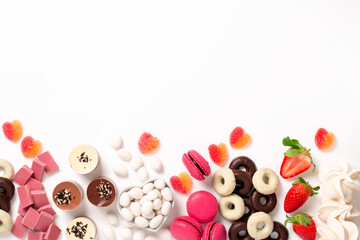 Valentines day background border with pink and chocolate sweets, copy space