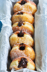 Homemade fried doughnuts with sugar and chocolate filling. Close up. - 484264856