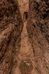 Narrow passage between rock-hewn churches in Lalibela, Ethiopia