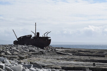 Plassey shipwreck on the beach. Ship stranded on rocks. Ship silhouette. Inisheer. Aran Island....