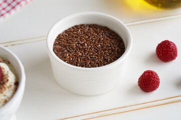 Flax seeds in a white bowl. Budwig diet