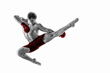 Fototapeta na wymiar Full size of athlete boxer who perform muay thai martial arts in studio silhouette. Red sportswear 