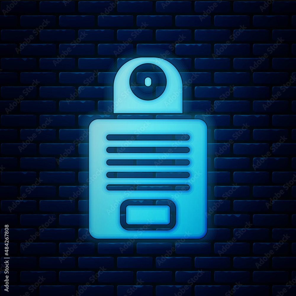 Poster glowing neon intercom icon isolated on brick wall background. vector