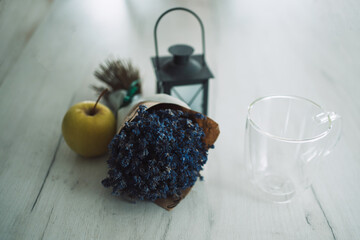 lavender bouquet green apple table lantern handmade marshmallow and empty glass mug on gray table.