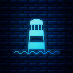 Glowing neon Lighthouse icon isolated on brick wall background. Vector