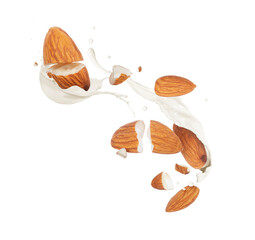 Crushed dried almonds with milk splashes in the air on a white background