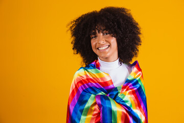 Young curly hair woman lgbt. Alone. Beautiful afro young happy woman with symbol of the LGBT Human...