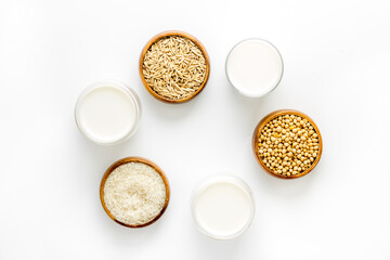 Dairy free vegan milk with nuts and cereals, top view