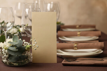 Stylish elegant table setting for festive dinner in restaurant