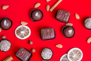 Composition of chocolate, red background