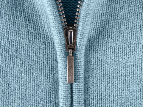 Zip Fastener Of Cashmere Sweater Macro. Fashionable Blue Jacket With Zipper Fastening For Cold Season. Half-zip Jumper Or Pullover Of Fine Soft Wool Jersey Close-up. Casual Stylish Clothes.