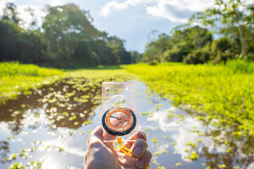 orientation with the compass in a canoe trip on the Gamboa river . At the community of Gamboa next...