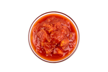 Chopped tomatoes in tomato juice in glass bowl isolated on white
