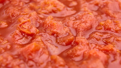 Chopped tomatoes in tomato juice food background