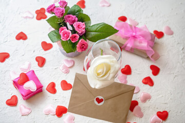 Valentines day greeting card with pink and white roses and gifts