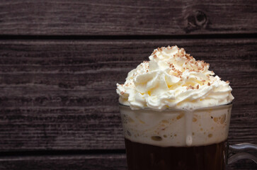 whipped cream on espresso coffee, cocoa sprinkled with grated chocolate
