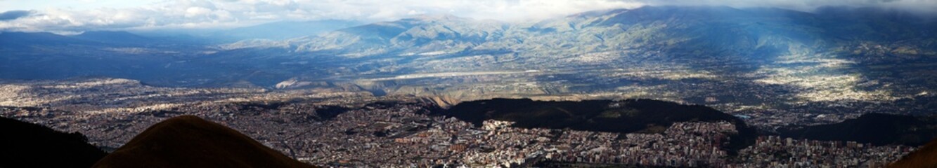 Panorama of busy South America city of Quito before sunset in Ecuador.