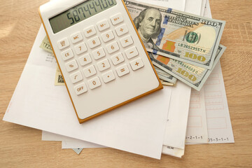 close-up of american dollars banknotes, financial documents, concept of filling out tax return, paying taxes, Corporate business income, expenses, maintaining household expenses, Gearing Up Startups