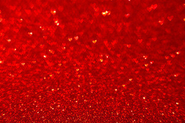 Red lights in the shape of bokeh heart defocusing a blurry blurry background for design of the Valentine's Day concept