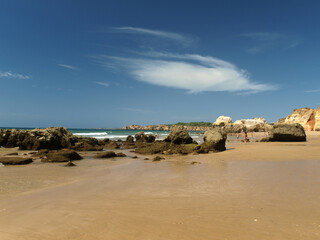 Fototapeta na wymiar A section of the idyllic Praia de Rocha beach on the Algarve region.