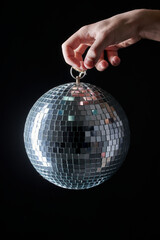 Man holding a disco ball, old school party concept