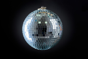 A hanging disco ball, retro partying, details of a mirrored surface