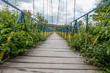 Old suspension bridge made of metal and iron