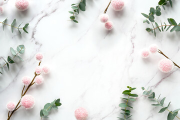 Fresh eucalyptus leaves, twigs with pink fluffy balls. Winter flat lay background, copy-space. Top...