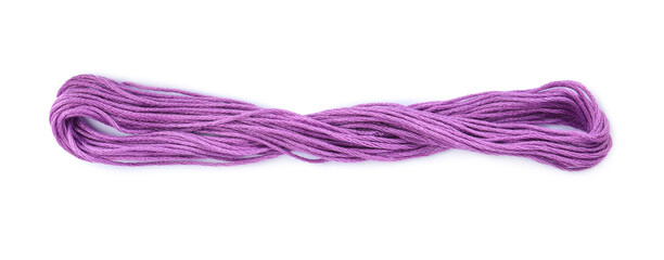 Bright violet embroidery thread on white background
