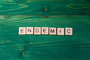 endemic sign on green wooden background