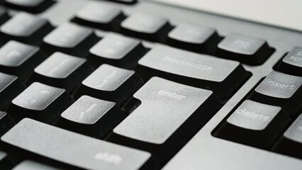 Pressing nervous on Enter key on keyboard. Close up typing on computer key repeatedly. Business man working late overtime and send emails, digital confirmations, accept transactions.