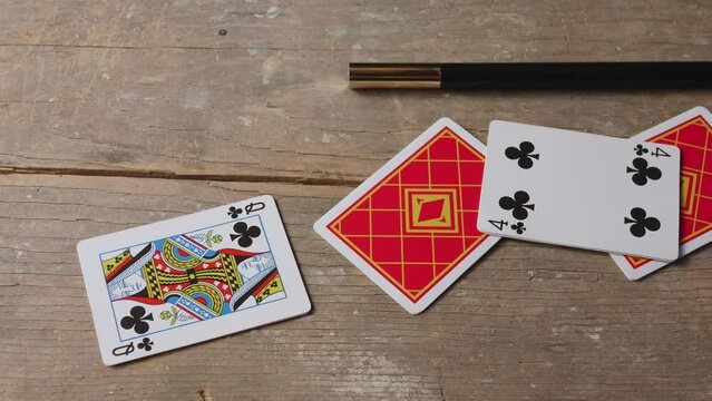 Magician Wand and Cards on Table