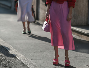 woman wearing pink dress and red open toe shoes