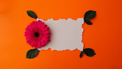 Flat lay access space for a message decorated with .gerber on an orange background